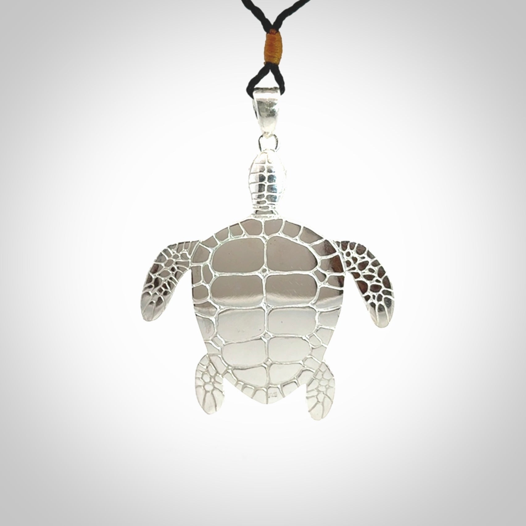 Snakeskin Agate stone turtle in Sterling silver engraved casing. Hand carved jewellery made by NZ Pacific and for sale online.