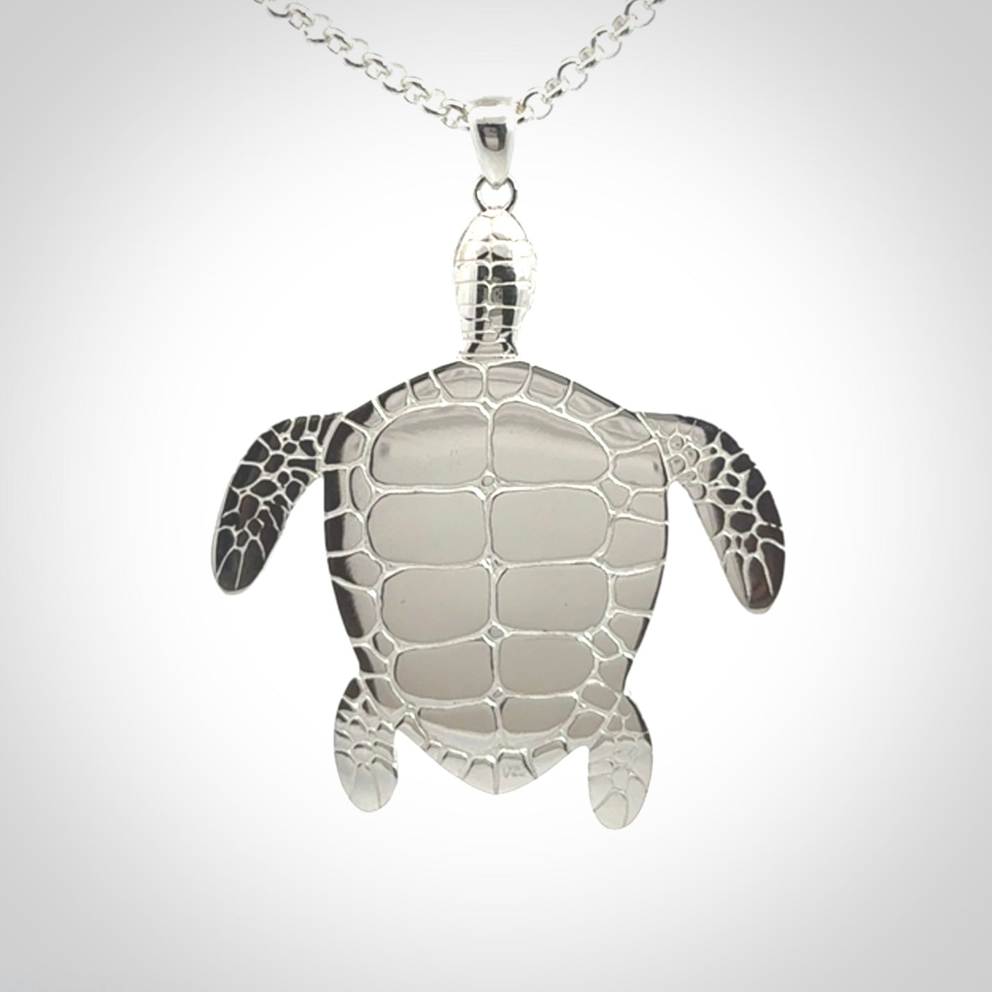 Snakeskin Agate stone turtle in Sterling silver engraved casing. Hand carved jewellery made by NZ Pacific and for sale online.