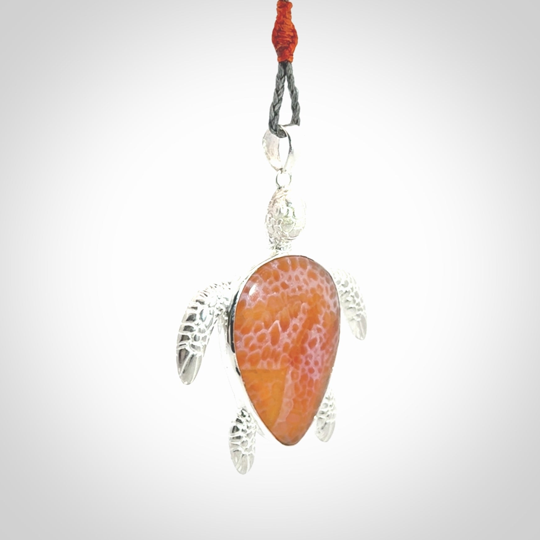 Snakeskin Agate stone turtle in Sterling silver engraved casing. Hand carved jewellery made by NZ Pacific and for sale online.
