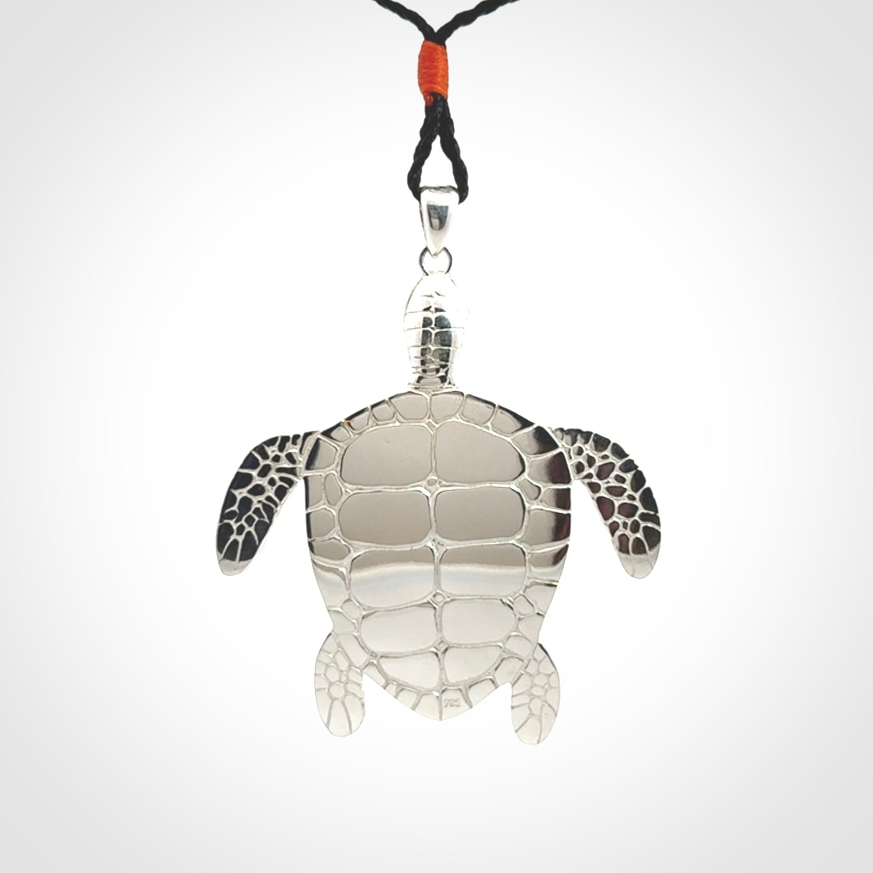 Snakeskin Agate stone turtle in Sterling silver engraved casing. Hand carved jewellery made by NZ Pacific and for sale online.