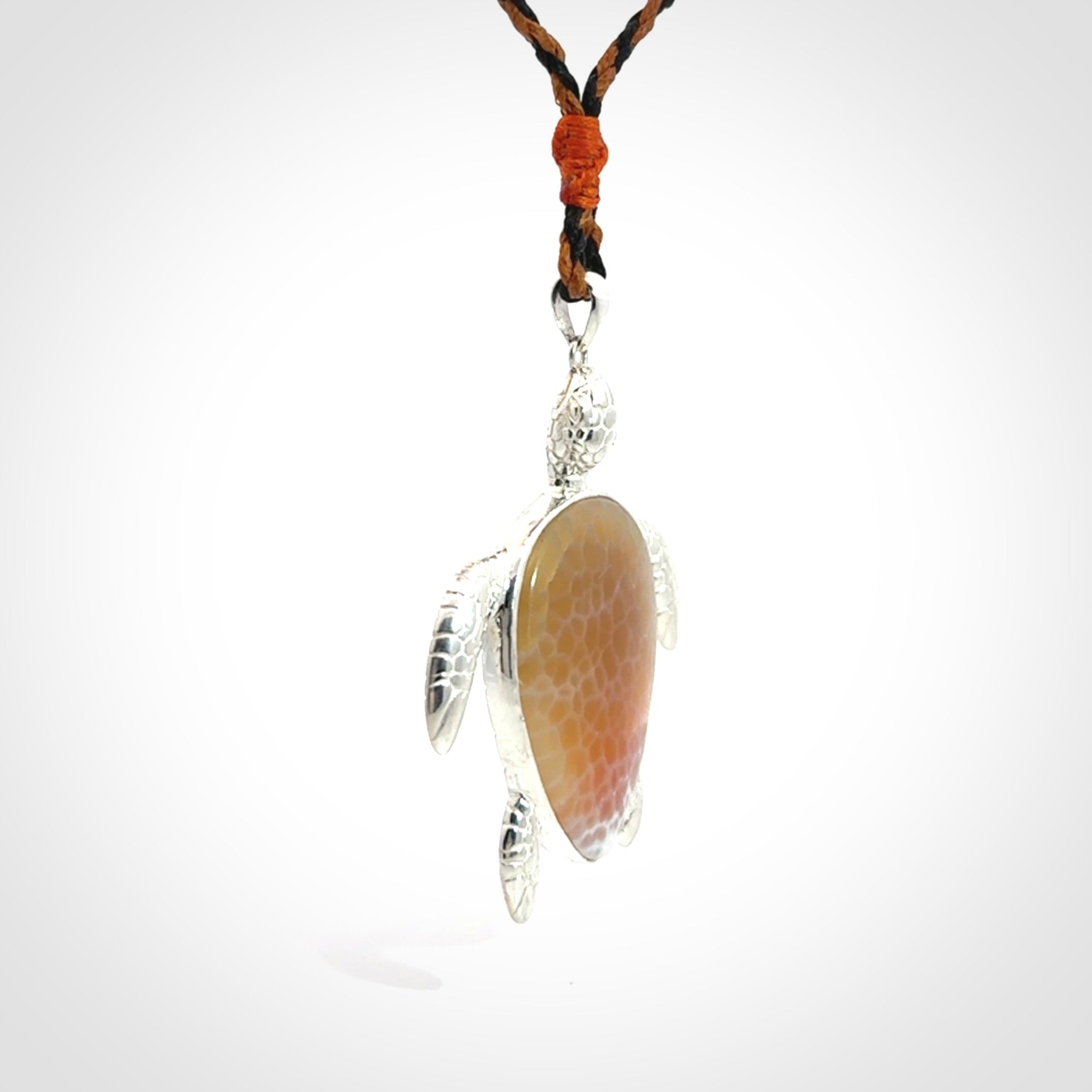 Snakeskin Agate stone turtle in Sterling silver engraved casing. Hand carved jewellery made by NZ Pacific and for sale online.