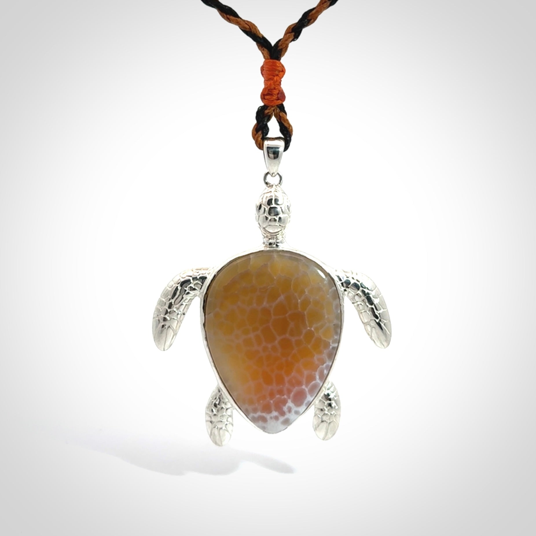Snakeskin Agate stone turtle in Sterling silver engraved casing. Hand carved jewellery made by NZ Pacific and for sale online.