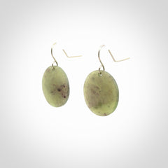 Hand crafted New Zealand Totoweka Jade drop earrings with Sterling Silver Hooks. Jade drop earrings, packaged in a woven kete pouch.