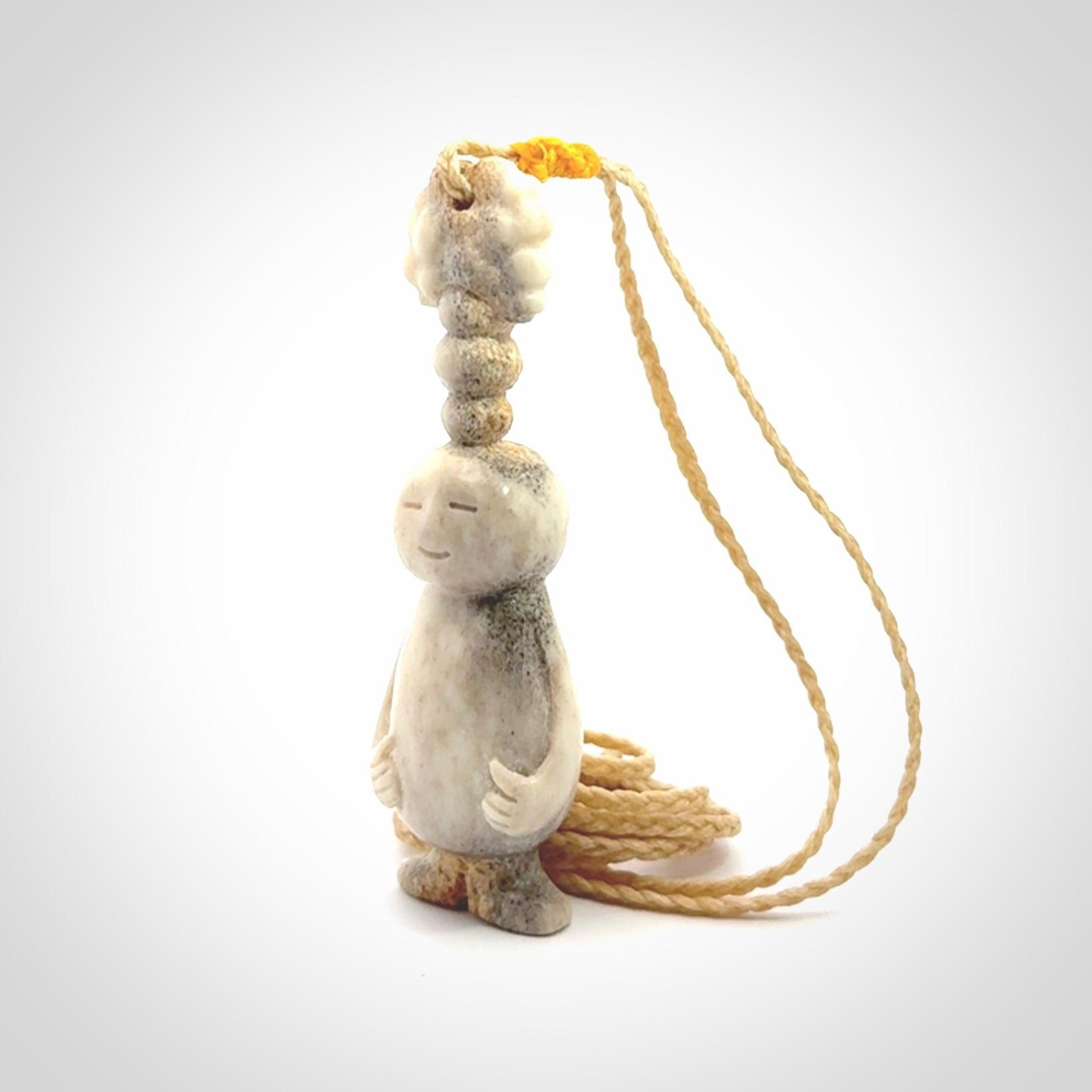 This is a hand carved deer antler daydreaming character pendant. It is made from deer antler, bone. This is a medium-large sized necklace with adjustable cord.