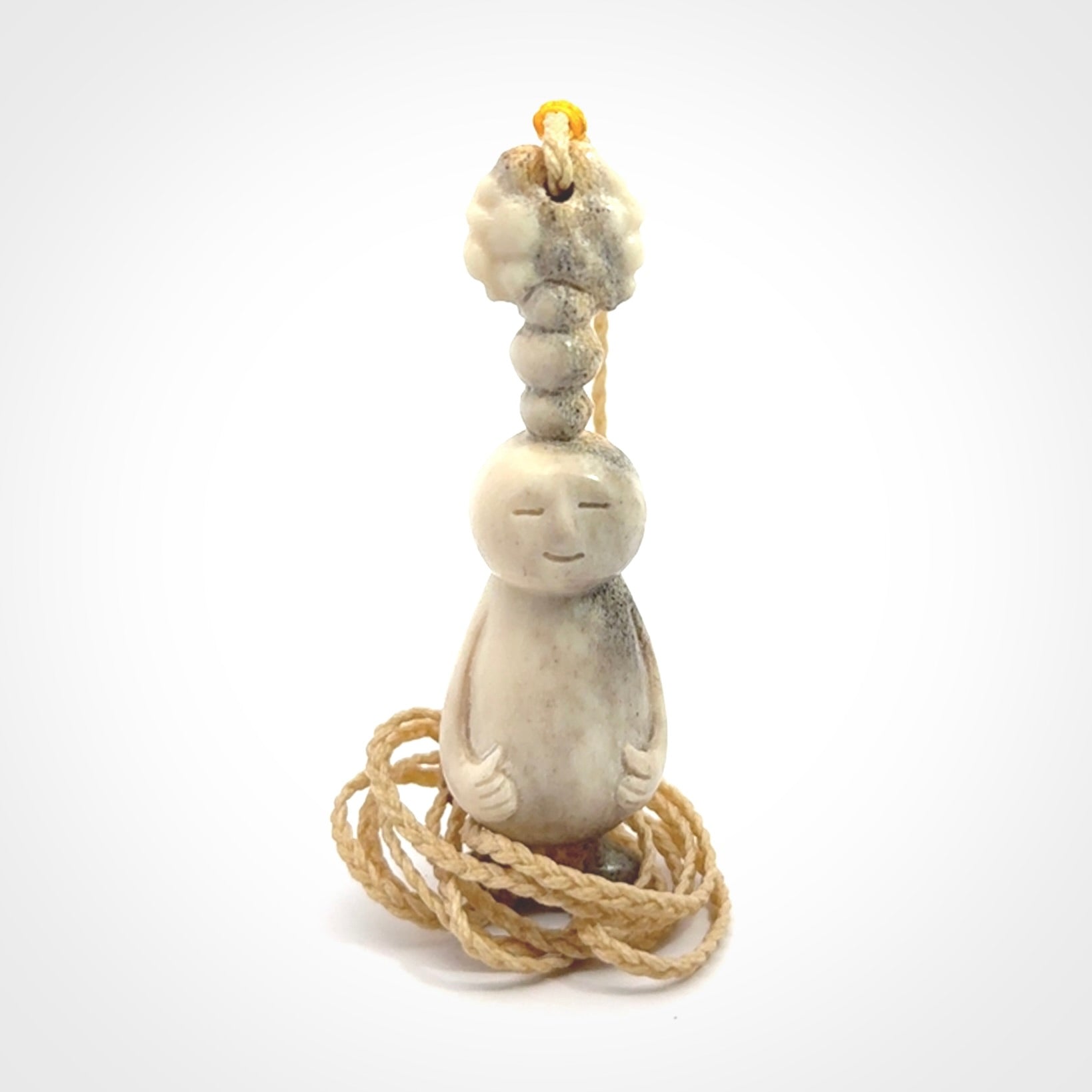 This is a hand carved deer antler daydreaming character pendant. It is made from deer antler, bone. This is a medium-large sized necklace with adjustable cord.