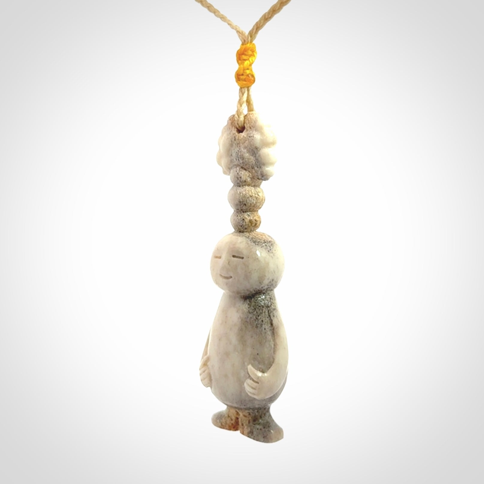 This is a hand carved deer antler daydreaming character pendant. It is made from deer antler, bone. This is a medium-large sized necklace with adjustable cord.