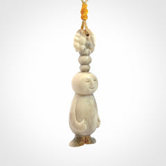 This is a hand carved deer antler daydreaming character pendant. It is made from deer antler, bone. This is a medium-large sized necklace with adjustable cord.