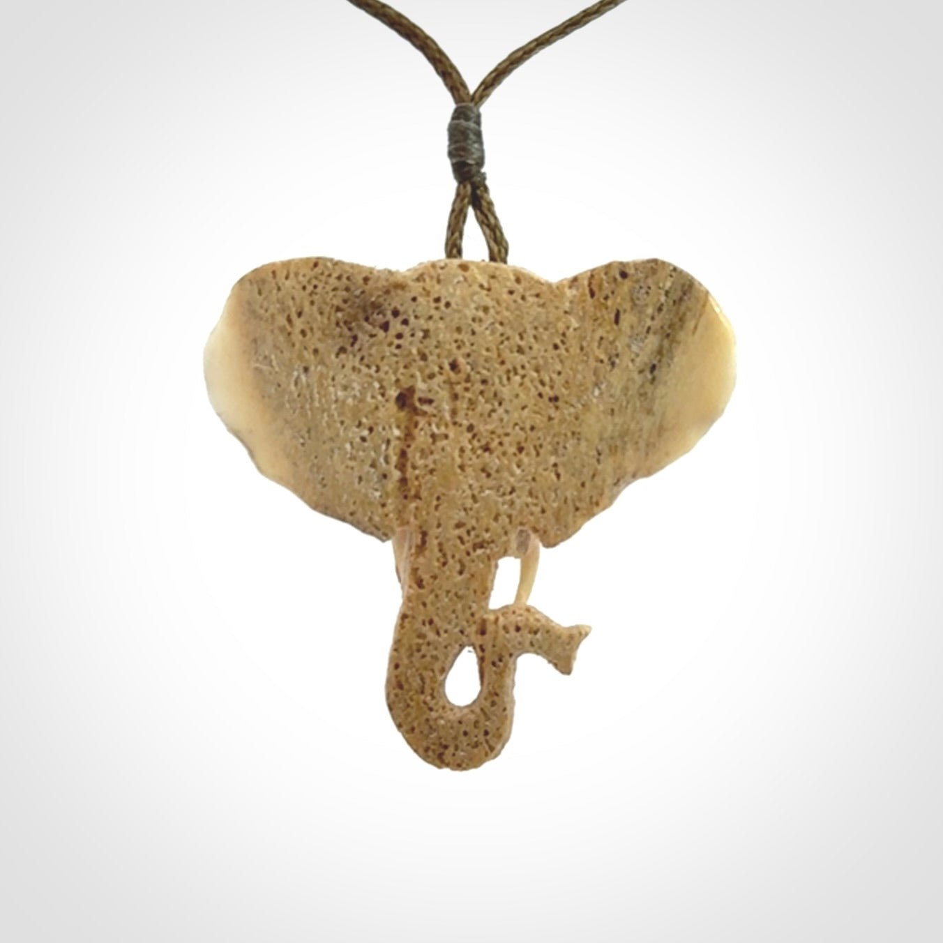 These are hand made elephant pendants, carved in a Deer Antler. The cord is length adjustable. Provided in a woven kete pouch and delivered with express courier.
