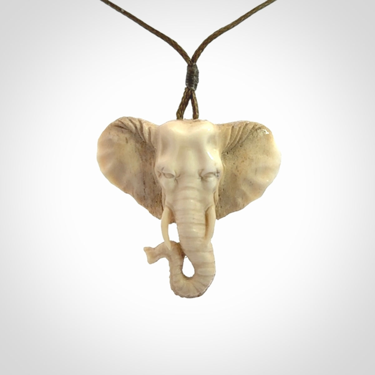 These are hand made elephant pendants, carved in a Deer Antler. The cord is length adjustable. Provided in a woven kete pouch and delivered with express courier.