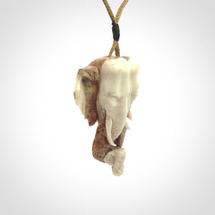 This is a triple elephant pendant, carved in a Deer Antler. The cord is length adjustable. Provided in a woven kete pouch and delivered with express courier.
