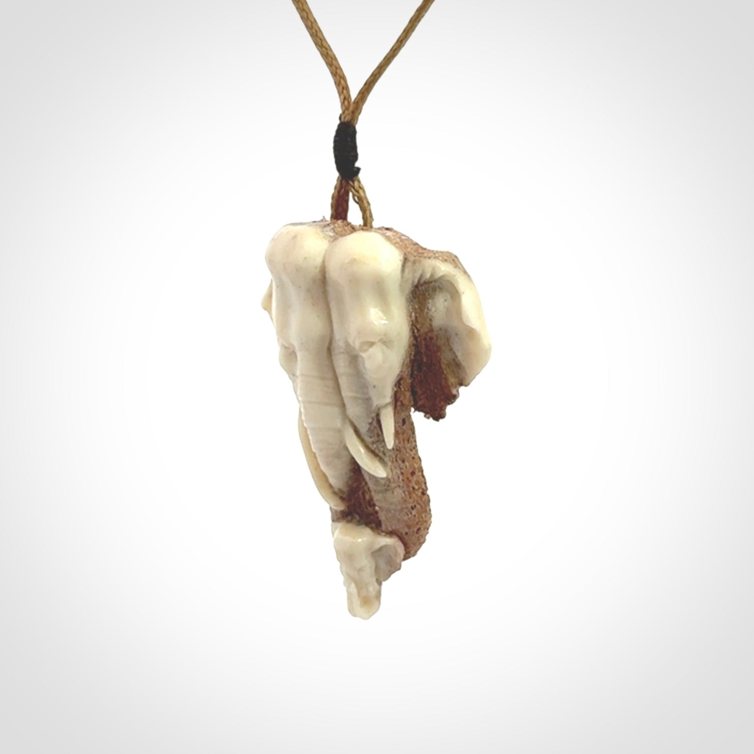 This is a triple elephant pendant, carved in a Deer Antler. The cord is length adjustable. Provided in a woven kete pouch and delivered with express courier.