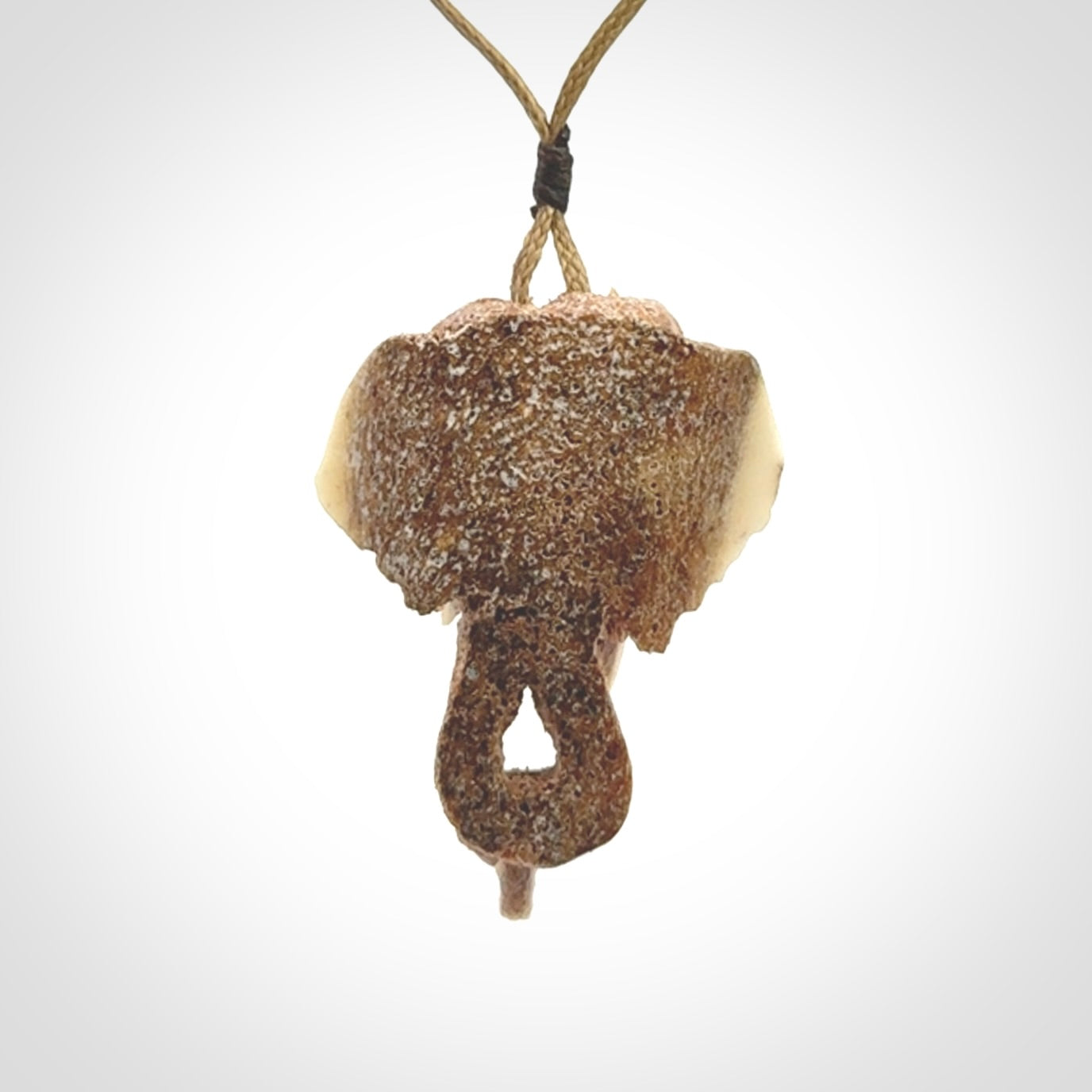 This is a triple elephant pendant, carved in a Deer Antler. The cord is length adjustable. Provided in a woven kete pouch and delivered with express courier.