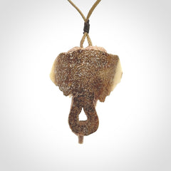 This is a triple elephant pendant, carved in a Deer Antler. The cord is length adjustable. Provided in a woven kete pouch and delivered with express courier.