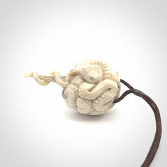 Hand carved deer antler brain with snake pendant. Hand carved by NZ Pacific. Free postage worldwide. Hand made brain with snake head necklace from deer antler. Brain with snake necklace for men and women.