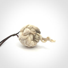 Hand carved deer antler brain with snake pendant. Hand carved by NZ Pacific. Free postage worldwide. Hand made brain with snake head necklace from deer antler. Brain with snake necklace for men and women.