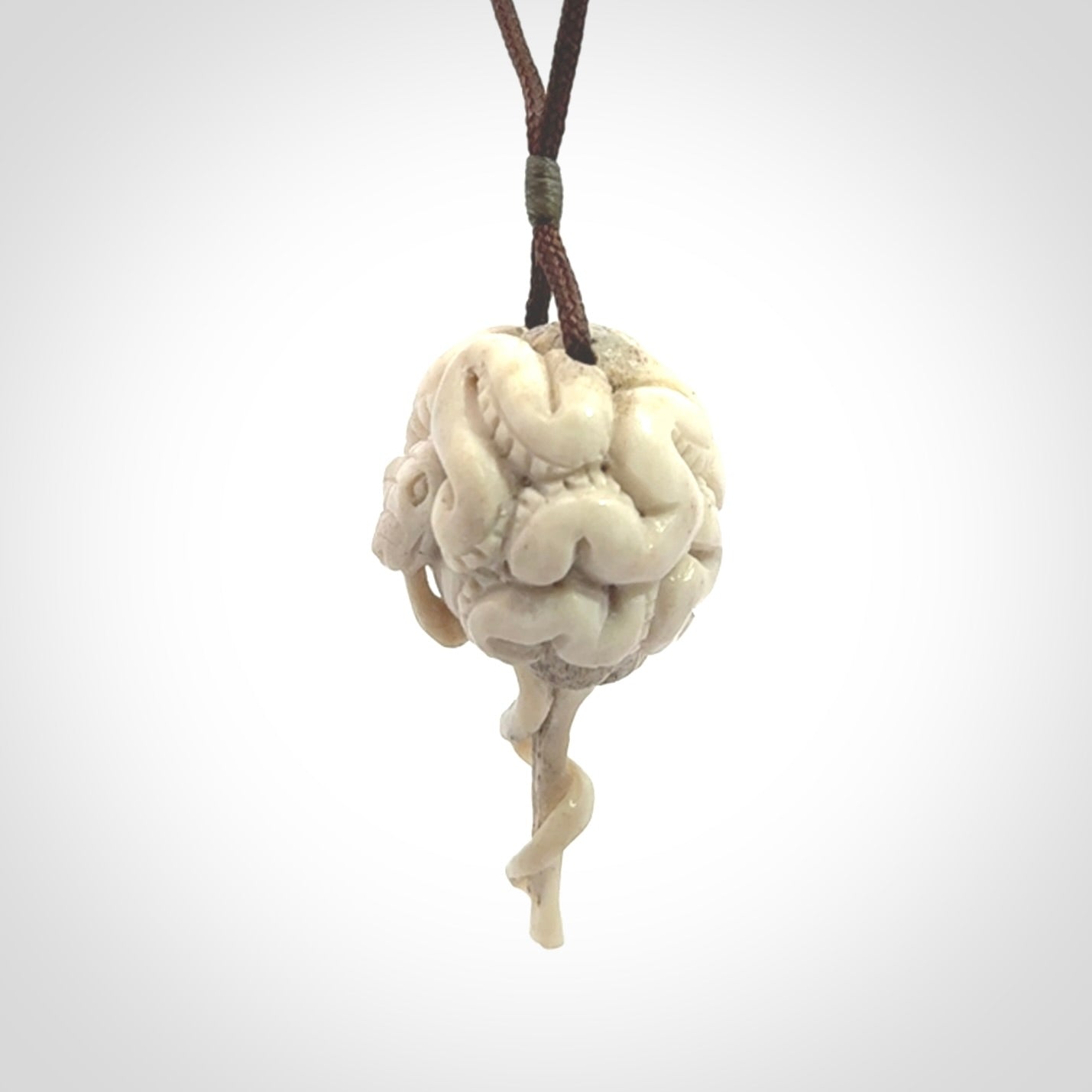 Hand carved deer antler brain with snake pendant. Hand carved by NZ Pacific. Free postage worldwide. Hand made brain with snake head necklace from deer antler. Brain with snake necklace for men and women.