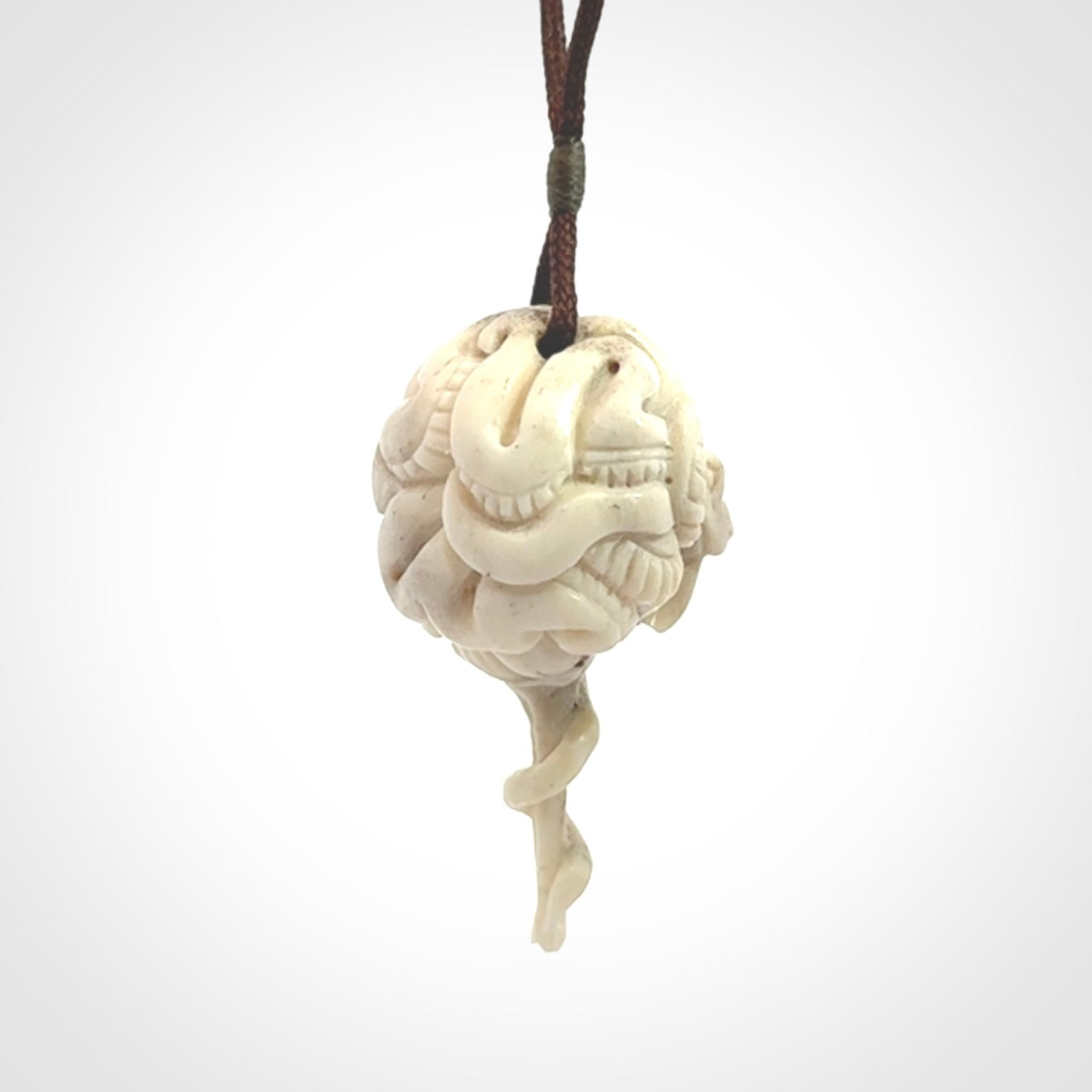 Hand carved deer antler brain with snake pendant. Hand carved by NZ Pacific. Free postage worldwide. Hand made brain with snake head necklace from deer antler. Brain with snake necklace for men and women.