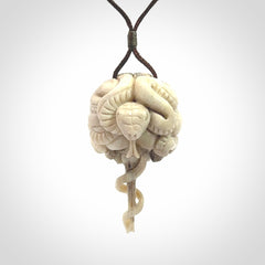 Hand carved deer antler brain with snake pendant. Hand carved by NZ Pacific. Free postage worldwide. Hand made brain with snake head necklace from deer antler. Brain with snake necklace for men and women.