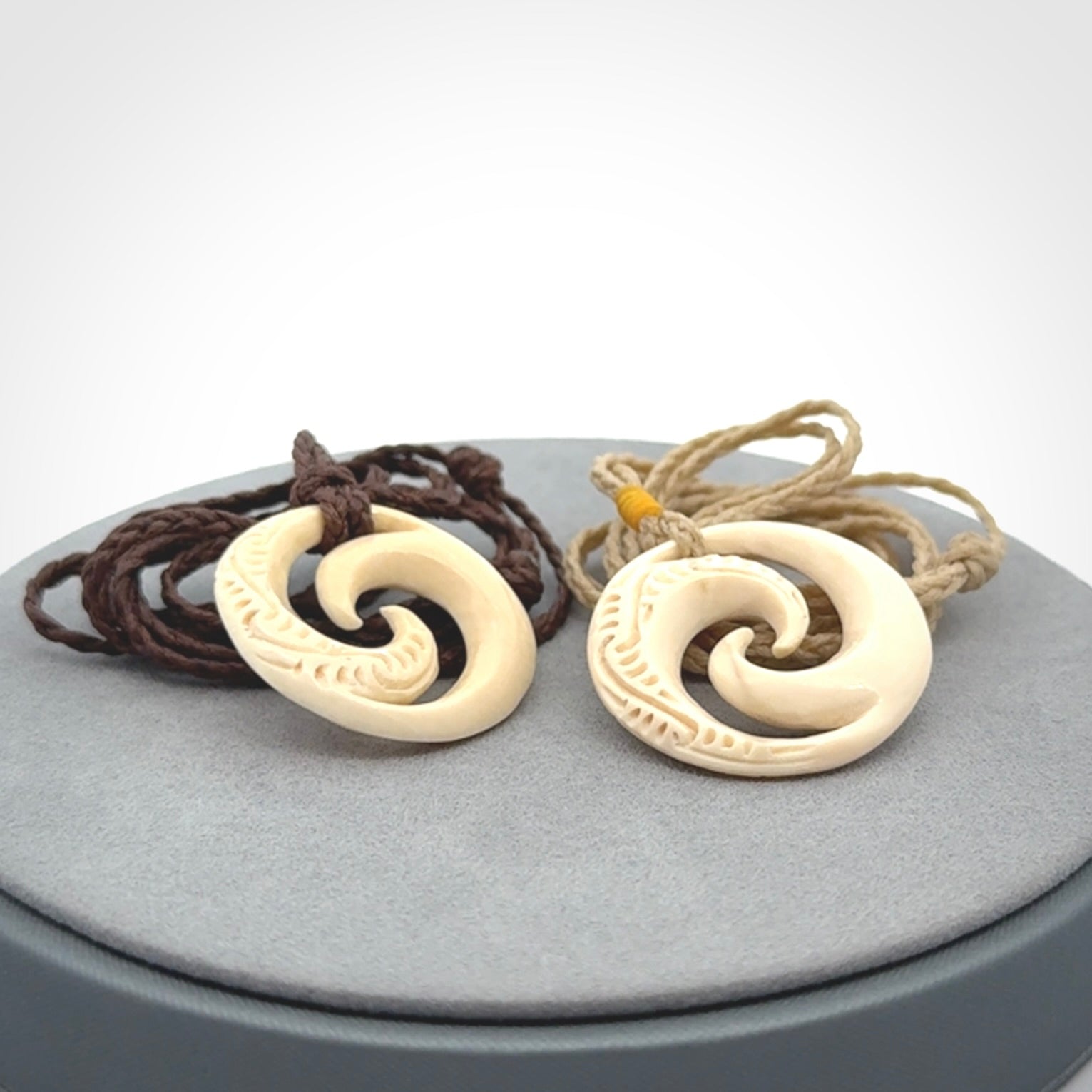 Hand carved koru pendant hand made in Woolly Mammoth tusk.