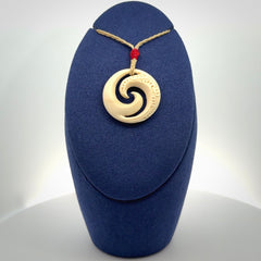 Hand carved koru pendant hand made in Woolly Mammoth tusk.