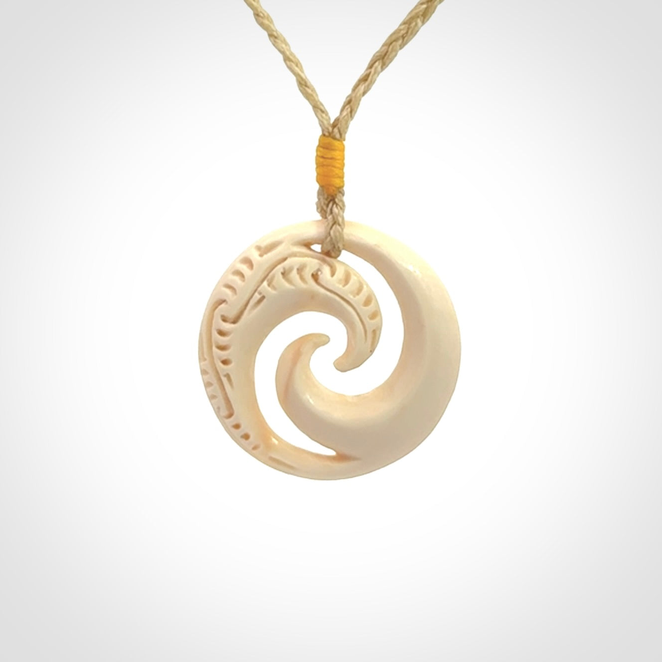Hand carved koru pendant hand made in Woolly Mammoth tusk.
