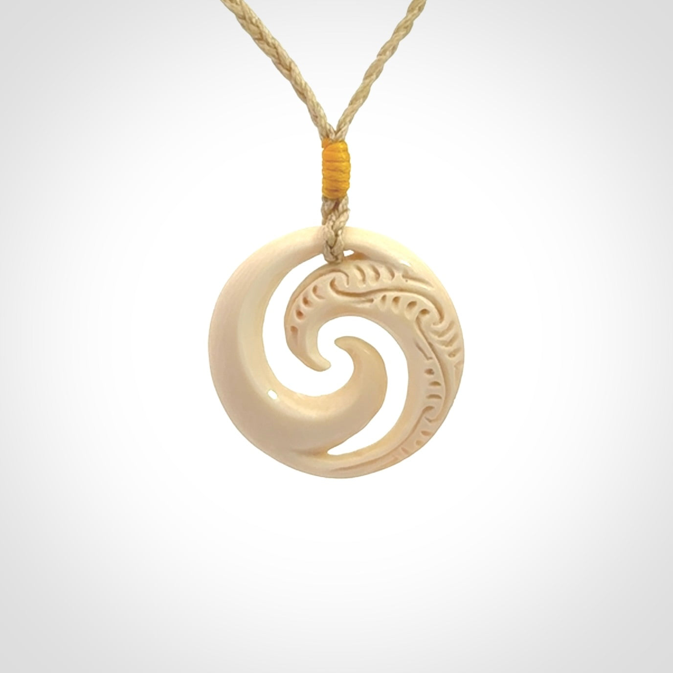 Hand carved koru pendant hand made in Woolly Mammoth tusk.