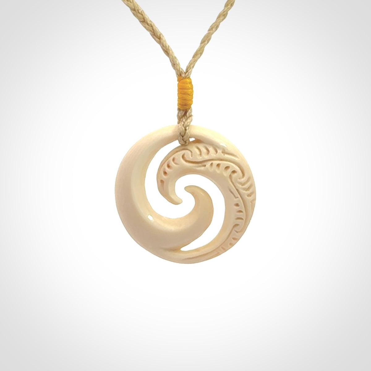 Hand carved koru pendant hand made in Woolly Mammoth tusk.