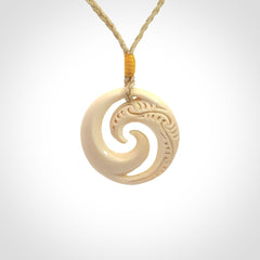 Hand carved koru pendant hand made in Woolly Mammoth tusk.