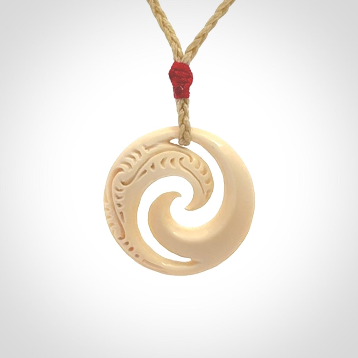 Hand carved koru pendant hand made in Woolly Mammoth tusk.