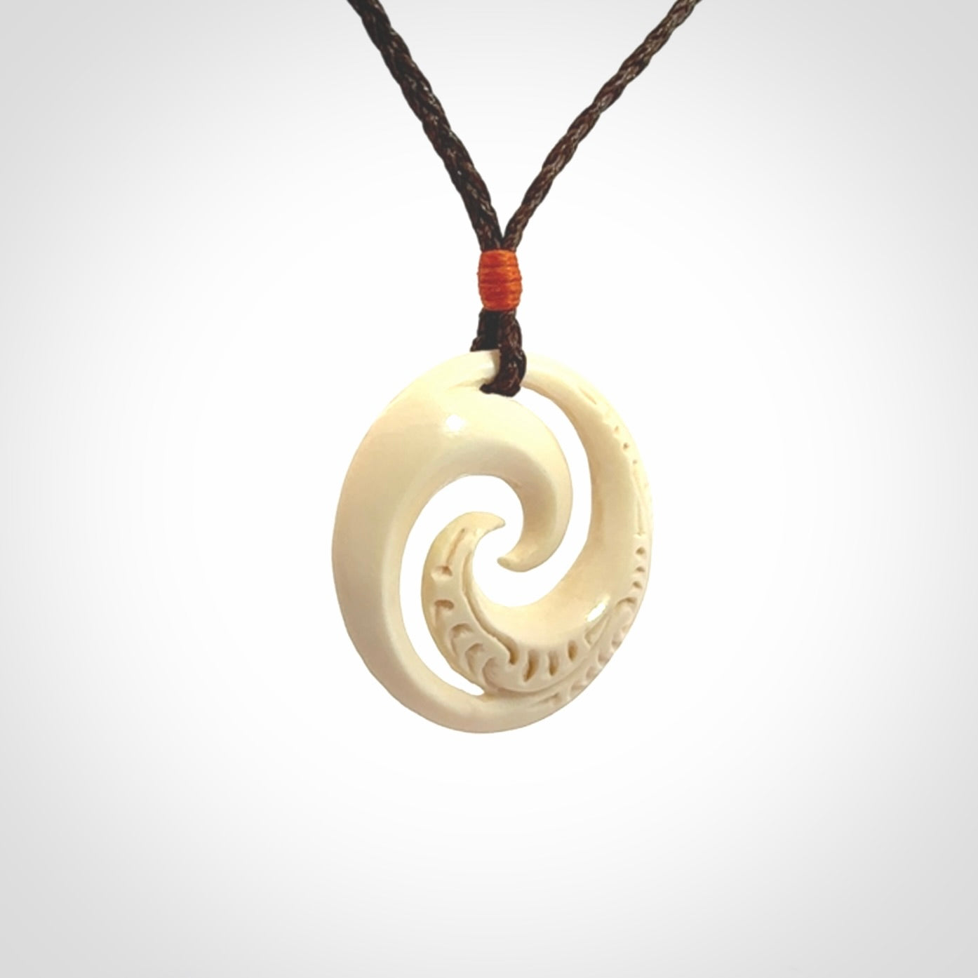 Hand carved koru pendant hand made in Woolly Mammoth tusk.