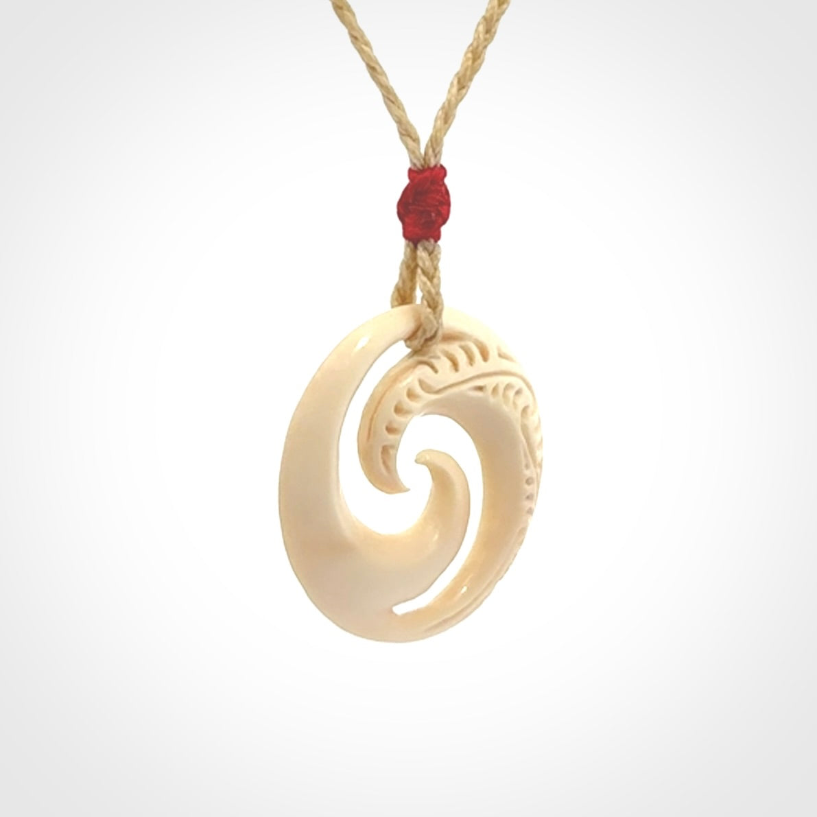 Hand carved koru pendant hand made in Woolly Mammoth tusk.