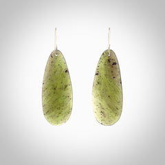 These are stunning large drop shaped jade earrings carved in New Zealand by Darren Hill. It is carved from a semi-translucent light green piece of New Zealand Jade and with Sterling Silver hooks.