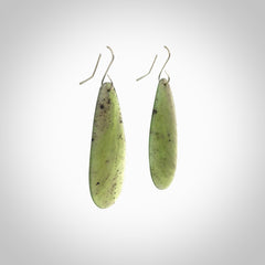 These are stunning large drop shaped jade earrings carved in New Zealand by Darren Hill. It is carved from a semi-translucent light green piece of New Zealand Jade and with Sterling Silver hooks.