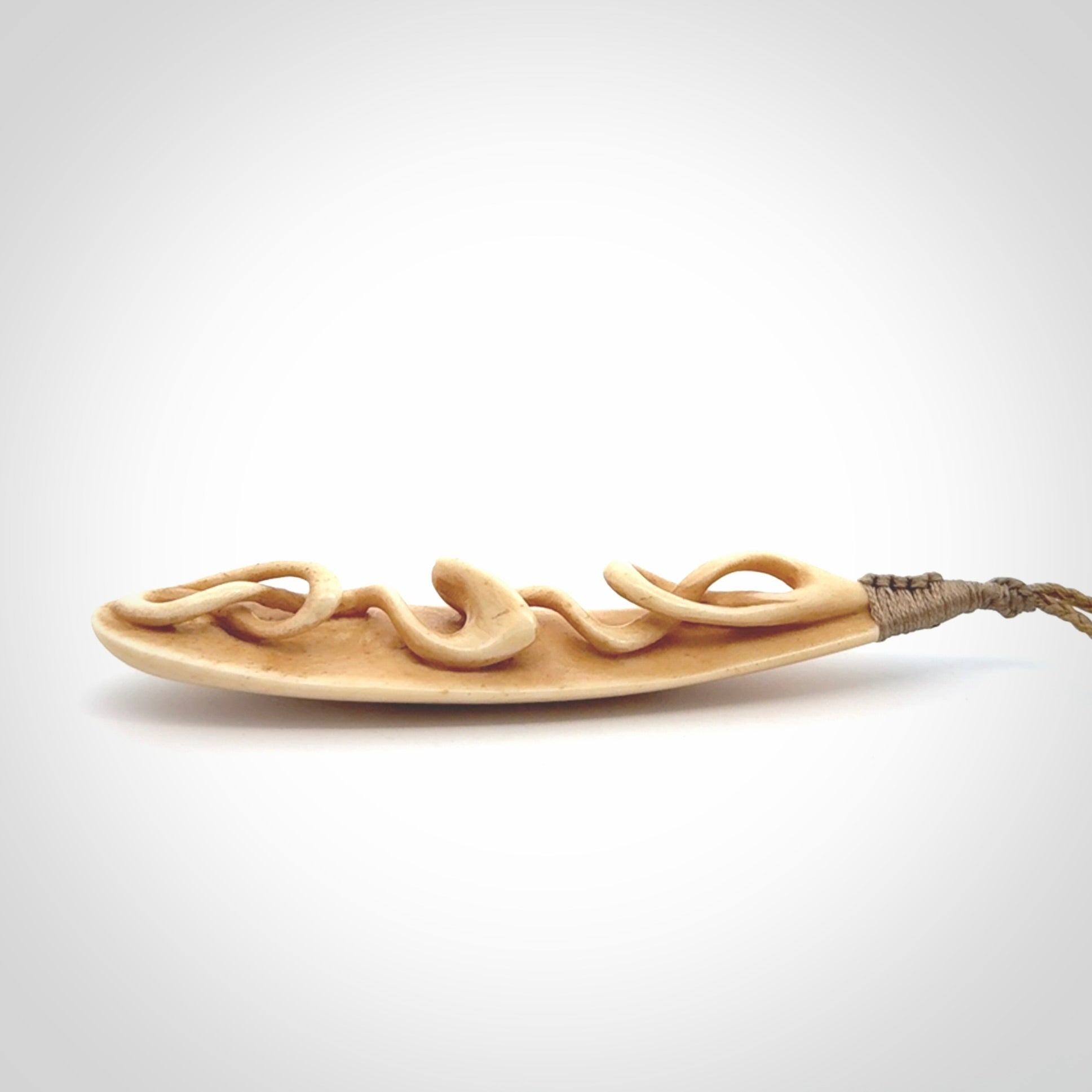 A handcarved masterpiece. A complex twist pendant carved from bone by Yuri Terenyi for NZ Pacific. This is a true piece of wearable art which is collectible. A one-off masterpiece and quite unique. Delivered with Express Courier and gift wrapped in a woven kete pouch.