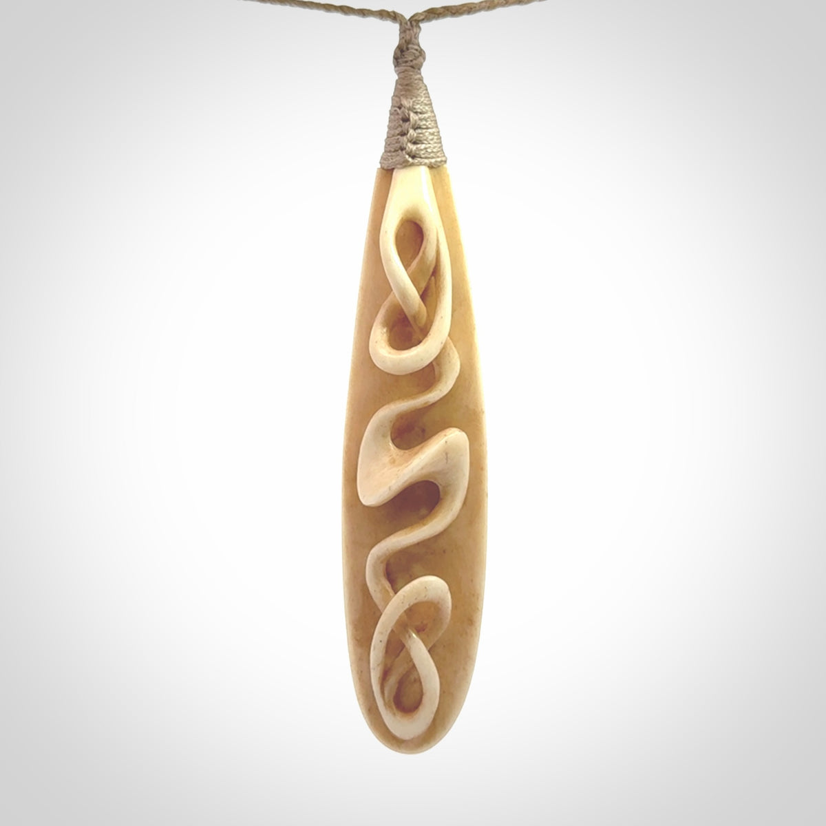 A handcarved masterpiece. A complex twist pendant carved from bone by Yuri Terenyi for NZ Pacific. This is a true piece of wearable art which is collectible. A one-off masterpiece and quite unique. Delivered with Express Courier and gift wrapped in a woven kete pouch.