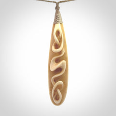 A handcarved masterpiece. A complex twist pendant carved from bone by Yuri Terenyi for NZ Pacific. This is a true piece of wearable art which is collectible. A one-off masterpiece and quite unique. Delivered with Express Courier and gift wrapped in a woven kete pouch.