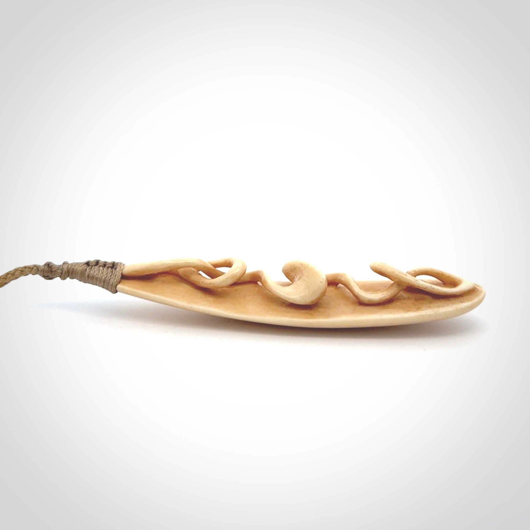 A handcarved masterpiece. A complex twist pendant carved from bone by Yuri Terenyi for NZ Pacific. This is a true piece of wearable art which is collectible. A one-off masterpiece and quite unique. Delivered with Express Courier and gift wrapped in a woven kete pouch.