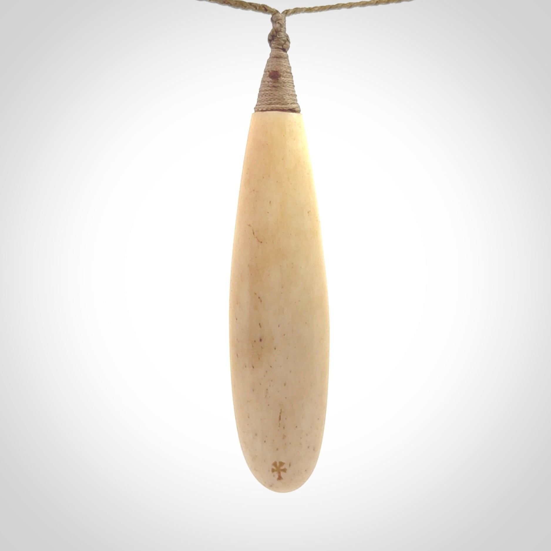 A handcarved masterpiece. A complex twist pendant carved from bone by Yuri Terenyi for NZ Pacific. This is a true piece of wearable art which is collectible. A one-off masterpiece and quite unique. Delivered with Express Courier and gift wrapped in a woven kete pouch.