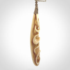 A handcarved masterpiece. A complex twist pendant carved from bone by Yuri Terenyi for NZ Pacific. This is a true piece of wearable art which is collectible. A one-off masterpiece and quite unique. Delivered with Express Courier and gift wrapped in a woven kete pouch.