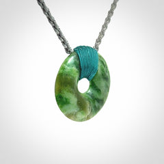 A Unique and Bold Disc Pendant with an Open Heart