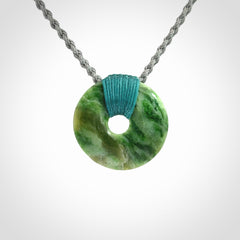 A Unique and Bold Disc Pendant with an Open Heart