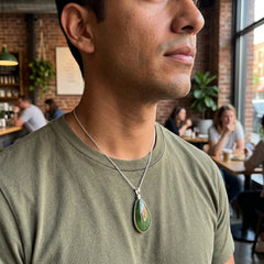 Man wearing Jade pendant