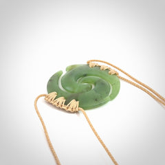 Two Jade koru partner pendants. Necklace hand carved in New Zealand jade, pounamu by NZ Pacific. These are partner pendants that represent partnerships. The jade is a beautiful bright green and we have suspended these on adjustable cords so that you can position the pendant where it suits you best. Postage is included in the price and we ship worldwide.