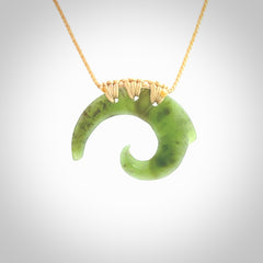Two Jade koru partner pendants. Necklace hand carved in New Zealand jade, pounamu by NZ Pacific. These are partner pendants that represent partnerships. The jade is a beautiful bright green and we have suspended these on adjustable cords so that you can position the pendant where it suits you best. Postage is included in the price and we ship worldwide.