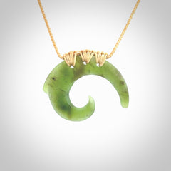 Two Jade koru partner pendants. Necklace hand carved in New Zealand jade, pounamu by NZ Pacific. These are partner pendants that represent partnerships. The jade is a beautiful bright green and we have suspended these on adjustable cords so that you can position the pendant where it suits you best. Postage is included in the price and we ship worldwide.