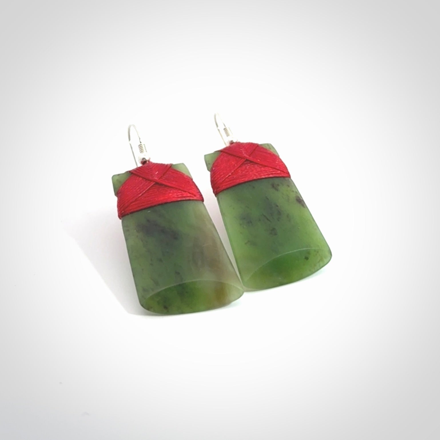 Hand crafted large, New Zealand Jade Totoweka toki earrings with Sterling Silver Hooks. Jade toki earrings, packaged in a woven kete pouch.