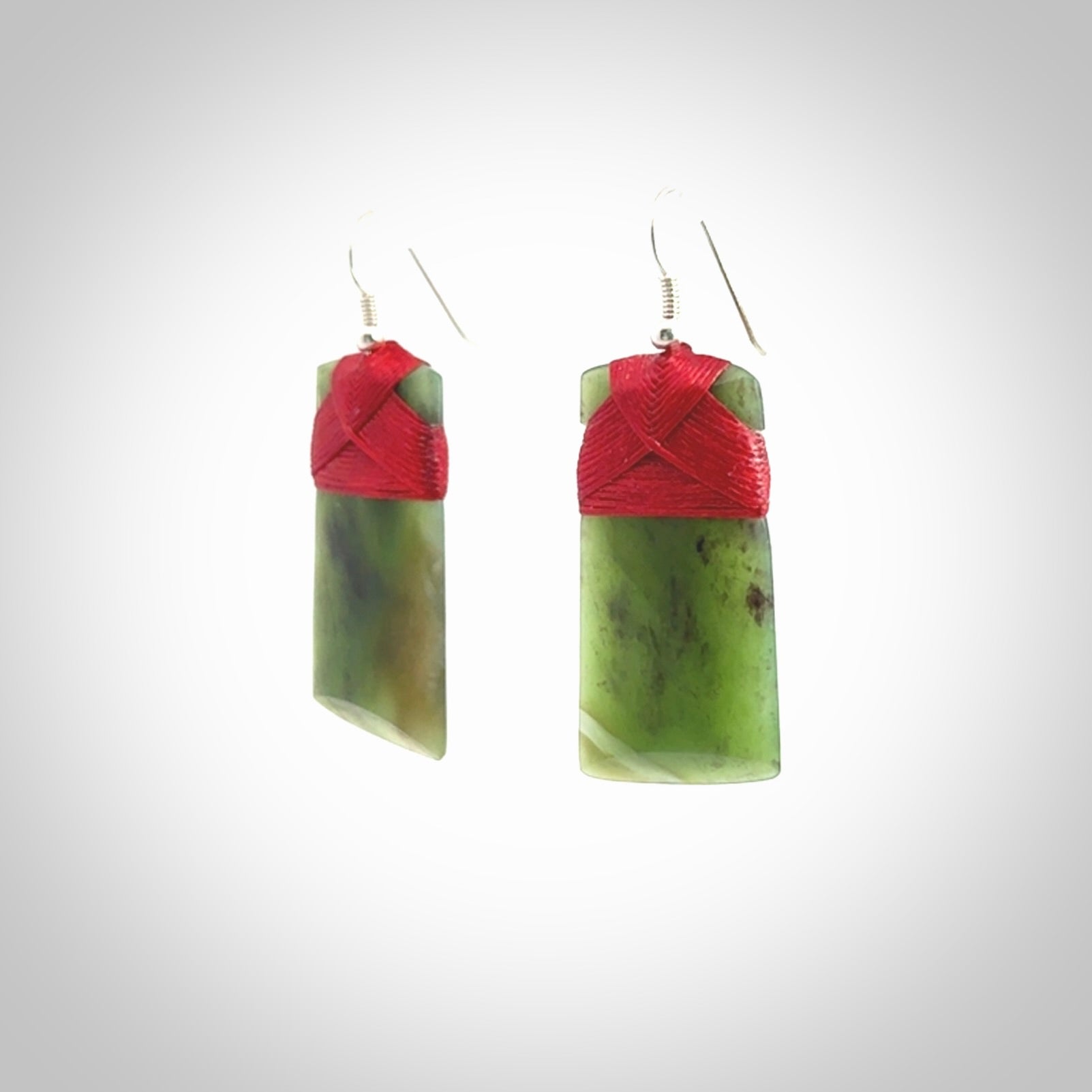 Hand crafted large, New Zealand Jade Totoweka toki earrings with Sterling Silver Hooks. Jade toki earrings, packaged in a woven kete pouch.