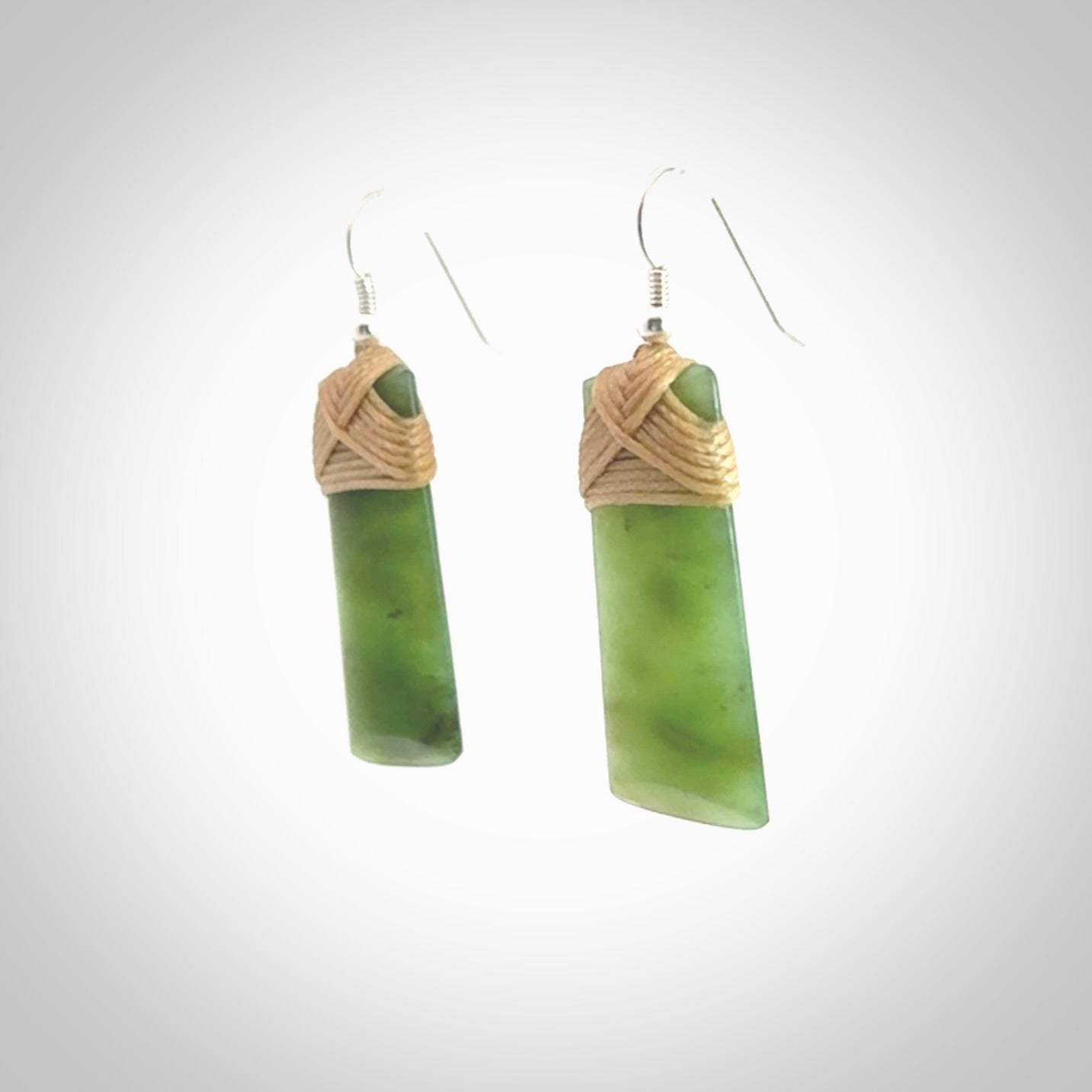 Hand crafted large, New Zealand Jade toki earrings with Sterling Silver Hooks. Jade toki earrings, packaged in a woven kete pouch.