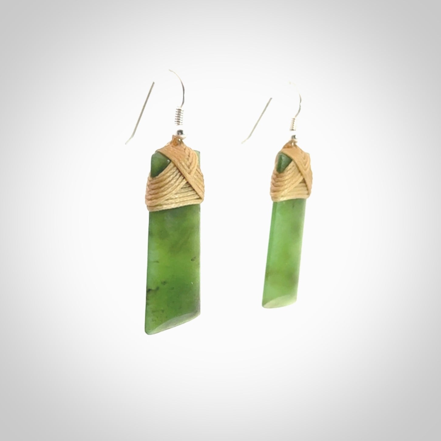 Hand crafted large, New Zealand Jade toki earrings with Sterling Silver Hooks. Jade toki earrings, packaged in a woven kete pouch.