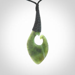 Hand carved jade koru pendant. Hand made in New Zealand by Donna Summers.